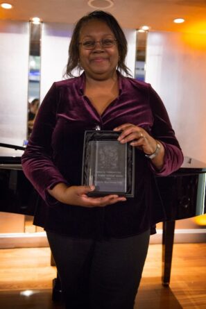 Malorie holding her J.M. Barrie award