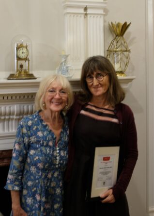 Vicky Ireland MBE standing with Baroness Beeban Kidron OBE who is holding The Vicky Ireland Award certificate